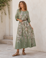 Rochie lungă cu mânecă 3/4 și imprimeu floral colorat, vedere frontală. All Above Boutique.