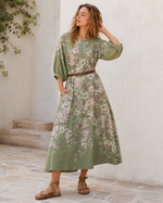 Rochie lungă cu mânecă 3/4 și imprimeu floral, vedere laterală. All Above Boutique.