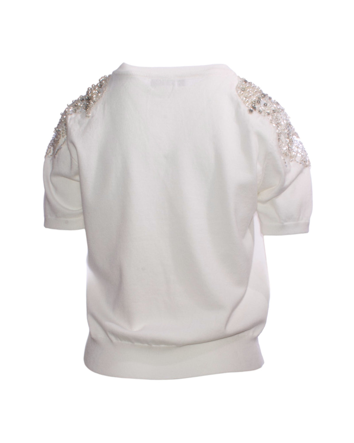 Bluză elegantă din material moale, vedere din spate, cu detaliile tulle-ului și paietelor vizibile pe umeri.