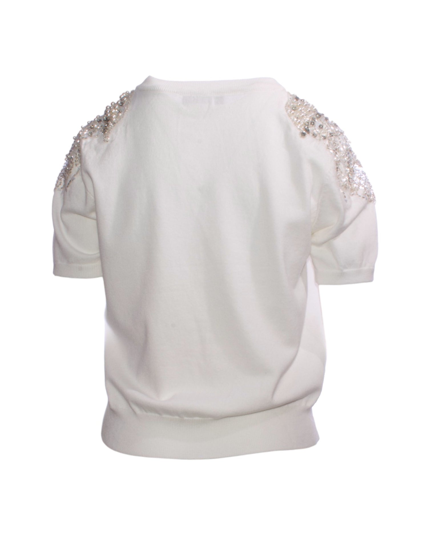 Bluză elegantă din material moale, vedere din spate, cu detaliile tulle-ului și paietelor vizibile pe umeri.