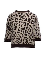 Bluza din tricot gros cu imprimeu animal print în tonuri de bej și maro, vedere frontală.