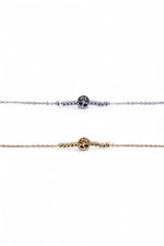 Două brățări subțiri din oțel inoxidabil, una argintie și una aurie, cu simbol Arborele Vieții și biluțe metalice, fotografiate în detaliu pe fundal alb.