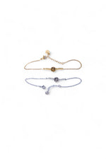 Două brățări din oțel inoxidabil cu simbol Arborele Vieții, una aurie și una argintie, prezentate pe fundal alb, vedere de ansamblu.