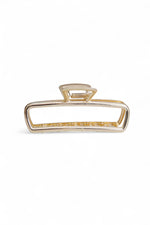 Clește de păr în nuanță alb-sidef, modern, cu design metalic glam.