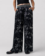 Pantaloni satinați din viscoză cu imprimeu simboluri boho, vedere din față, All Above Boutique.
