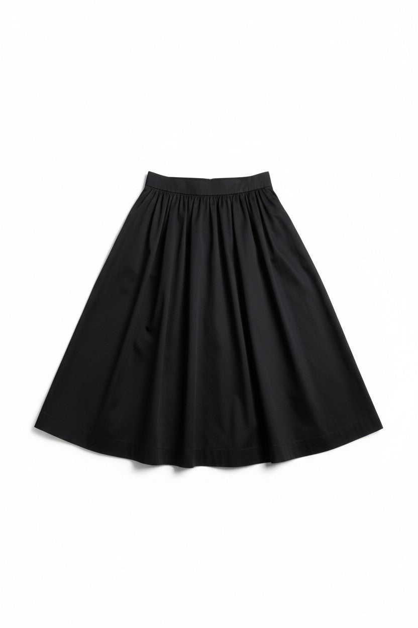 Fustă tip A din bumbac, prezentare flat lay, cu croială amplă și finisaj curat.