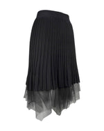 Fustă scurtă din tricot negru, cu talie elastică și strat inferior din tul, vedere laterală.