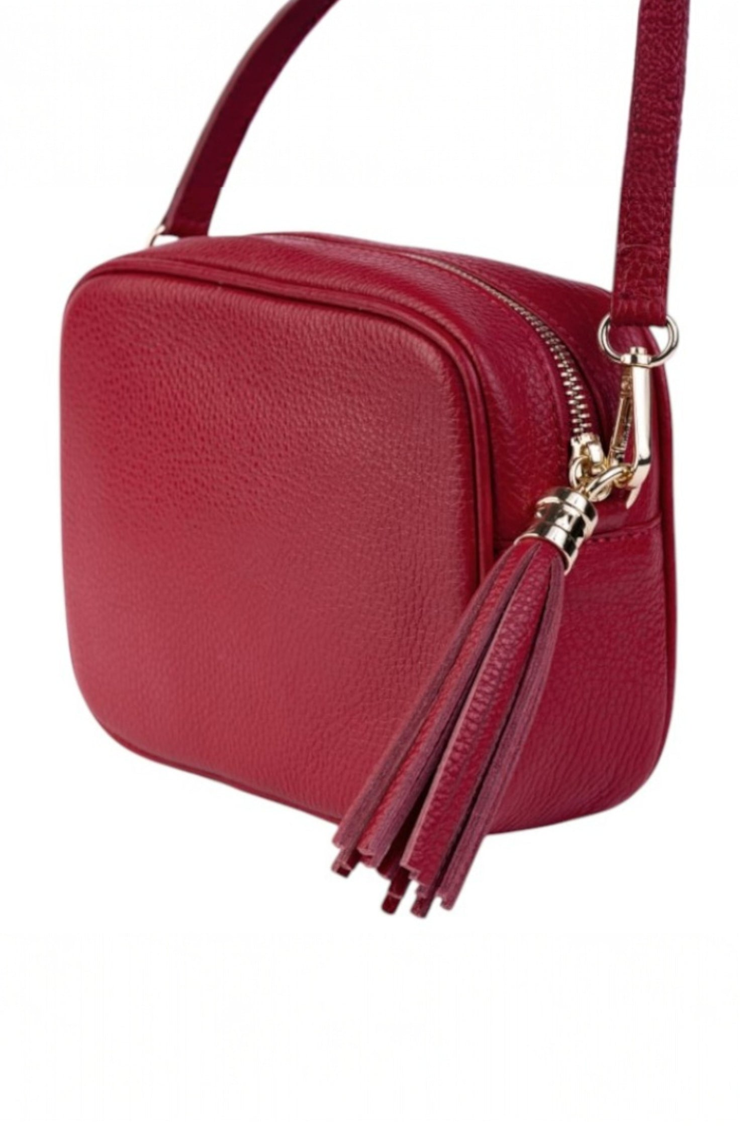Geantă crossbody roșie din piele ecologică, cu detaliu de ciucure și curea reglabilă.