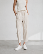 Pantaloni conici crem din viscoză, cu talie elastică și croială fluidă — All Above Boutique.