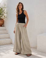 Pantaloni lungi din in cu manșetă la gleznă și șiret în talie, vedere laterală. All Above Boutique.