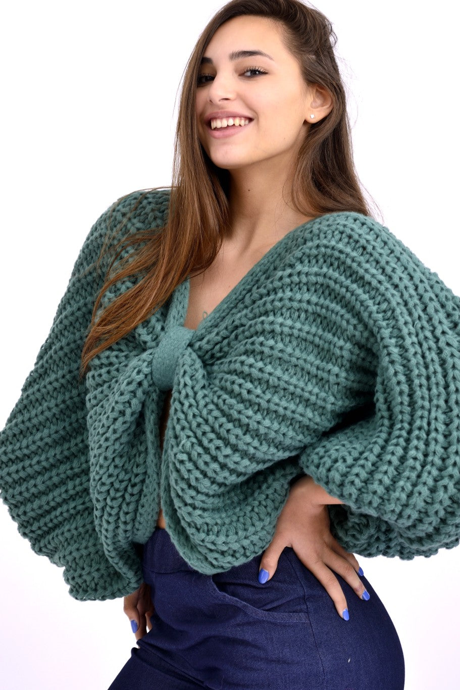 Detaliu textură tricotată cu ochiuri mari, material moale verde.