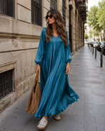Rochie satinată cu mâneci lungi și buzunare, nuanța turcoaz închis, vedere din față