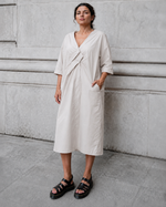 Rochie bej din bumbac 100% cu decolteu în pliuri, vedere frontală. All Above Boutique.