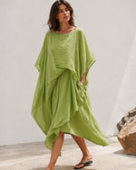 Rochie midi din bumbac verde fistic, cu prinderi laterale și tiv asimetric în colț — All Above Boutique.
