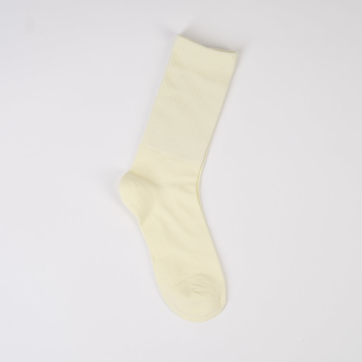  Șosetă lungă în nuanță crem deschis, tricotată fin din bumbac cu elastic în partea de sus