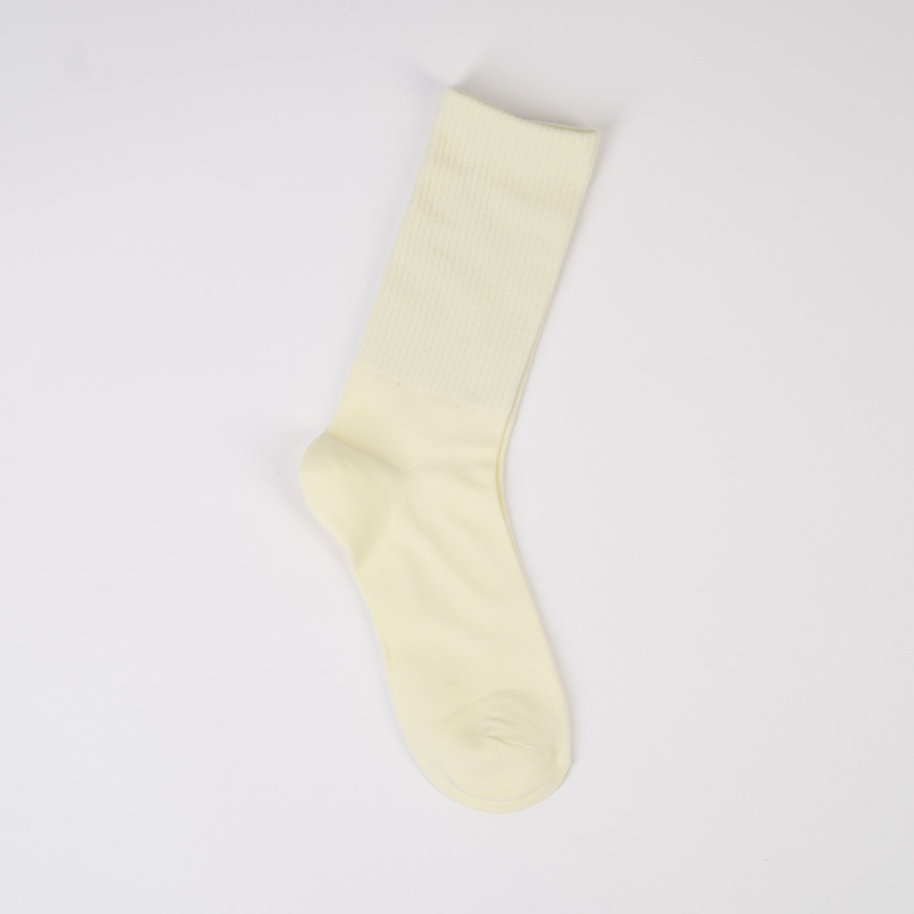  Șosetă lungă în nuanță crem deschis, tricotată fin din bumbac cu elastic în partea de sus