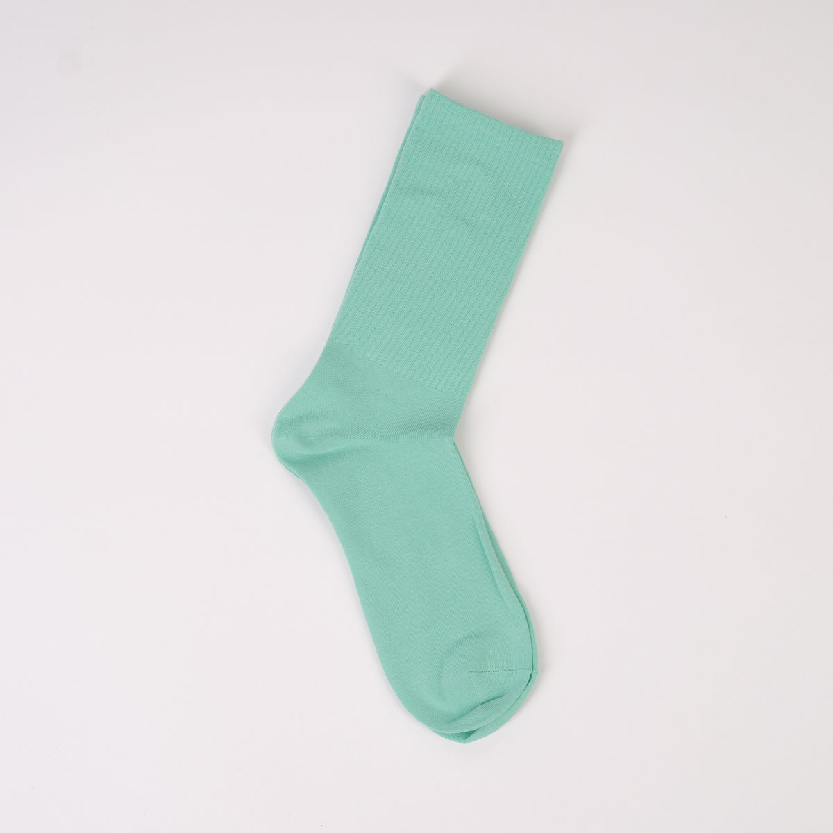 Șosetă în nuanță turcoaz cu elastic lejer și design reiat în partea de sus