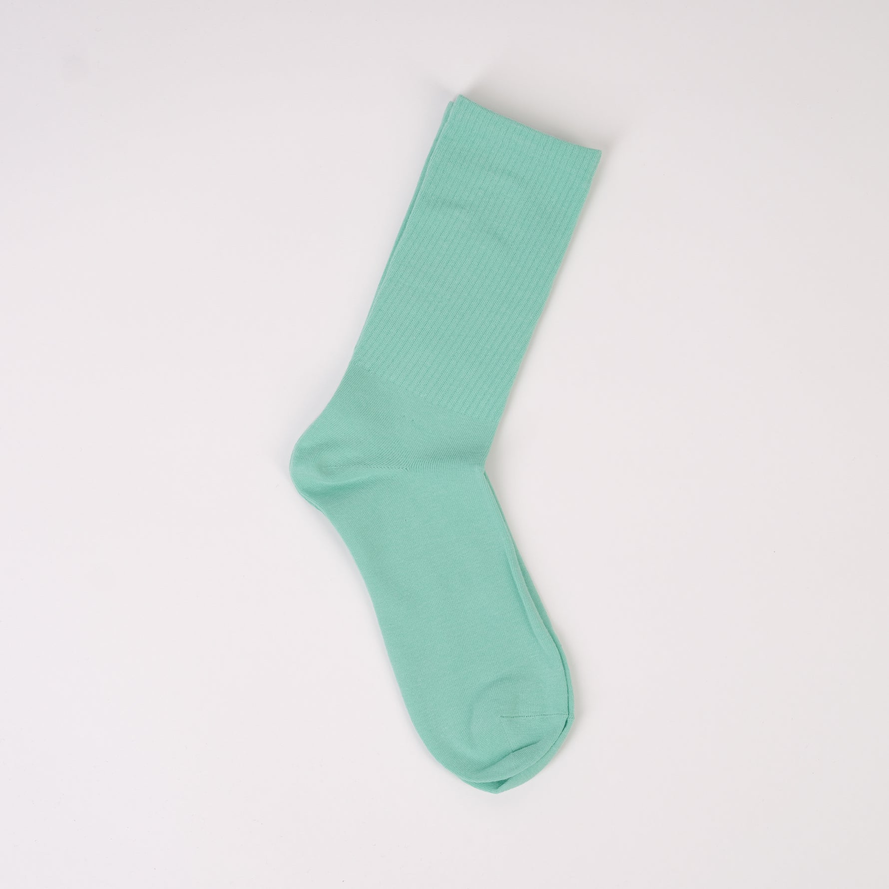Șosetă în nuanță turcoaz cu elastic lejer și design reiat în partea de sus