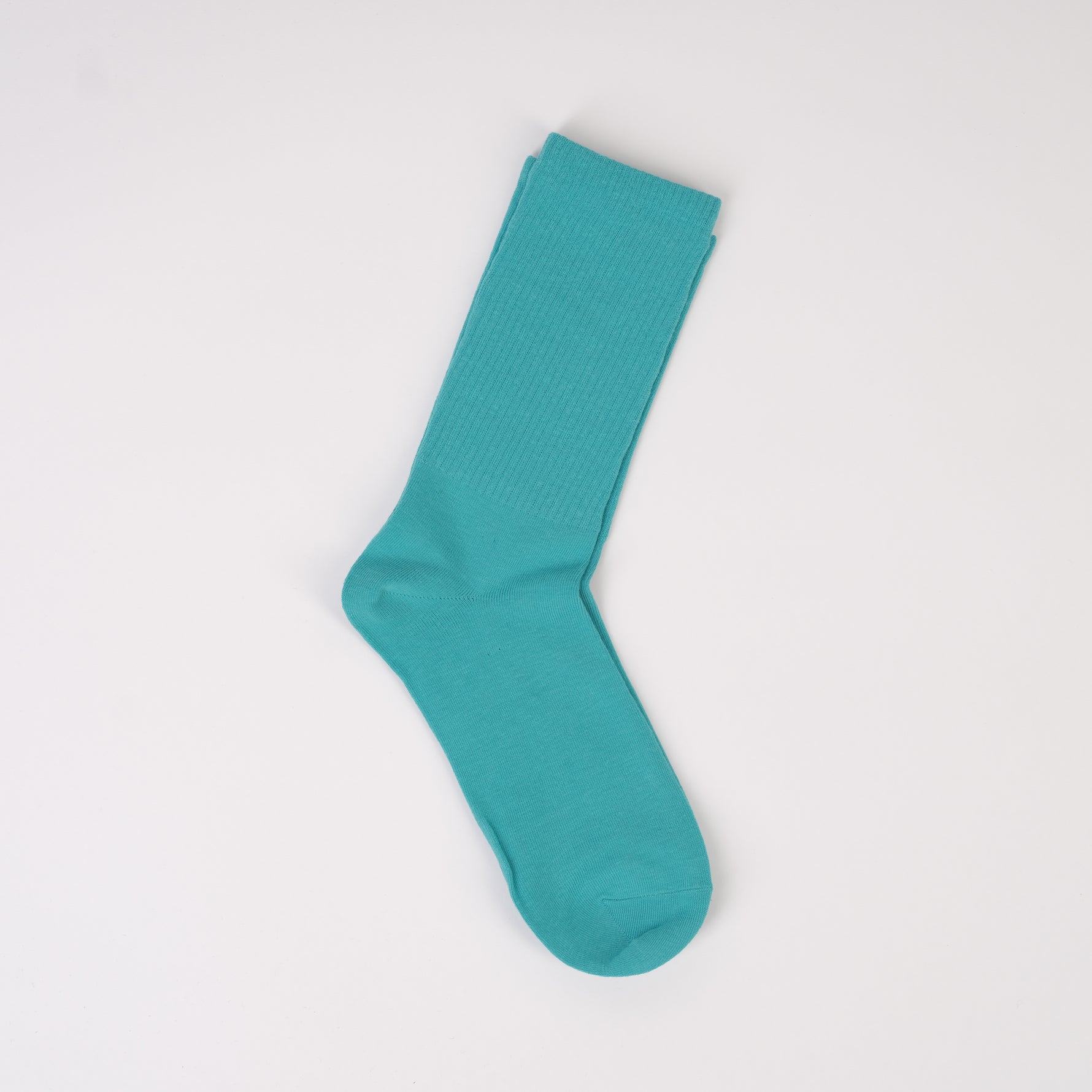 Șosetă verde mentă deschisă, cu aspect minimalist și textură moale
