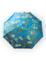 Umbrelă compactă, pliată, cu husă de transport și imprimeu artistic „Migdal Înflorit”.