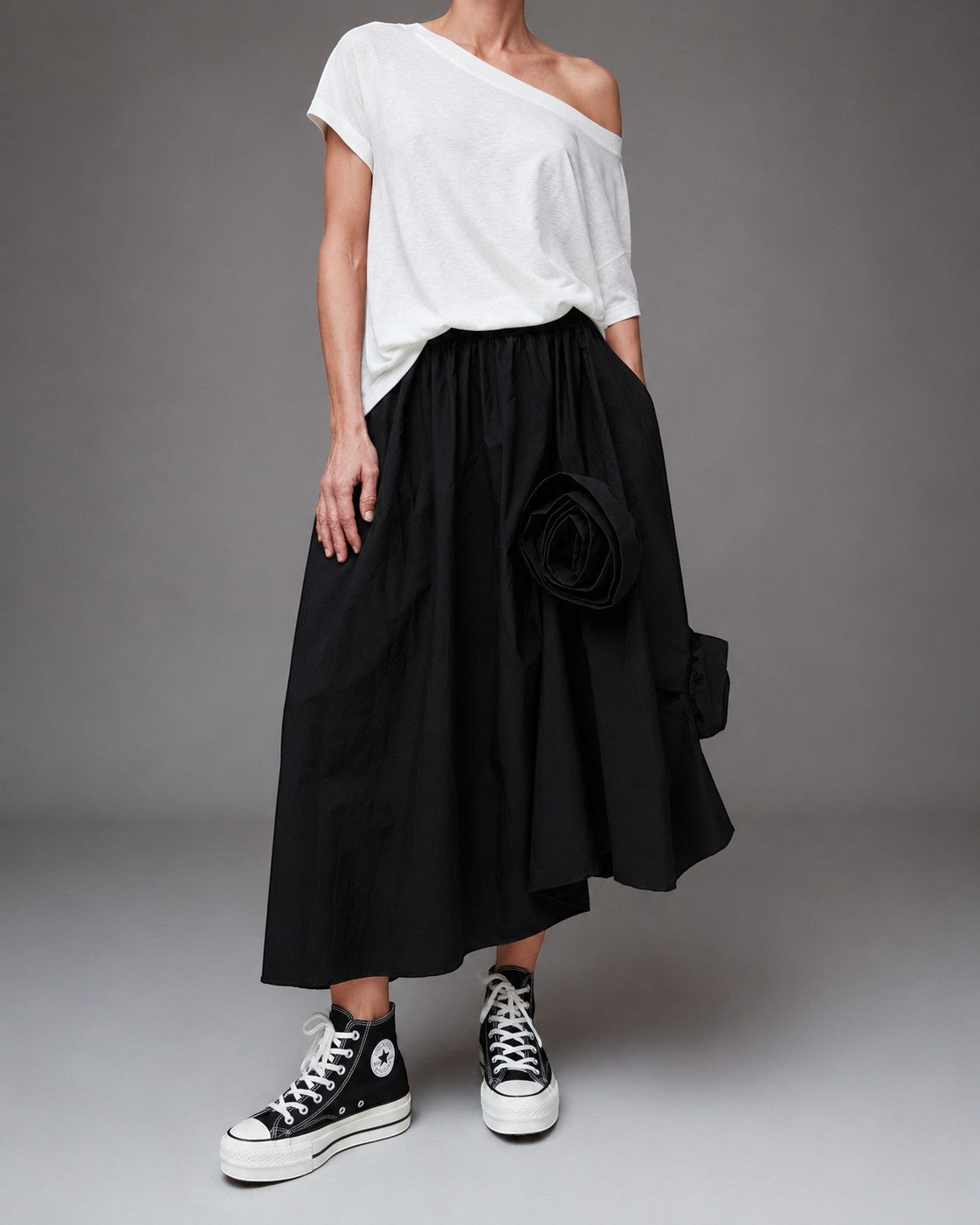 All Above Boutique black cotton asymmetric skirt with applied floral detail and elastic waist