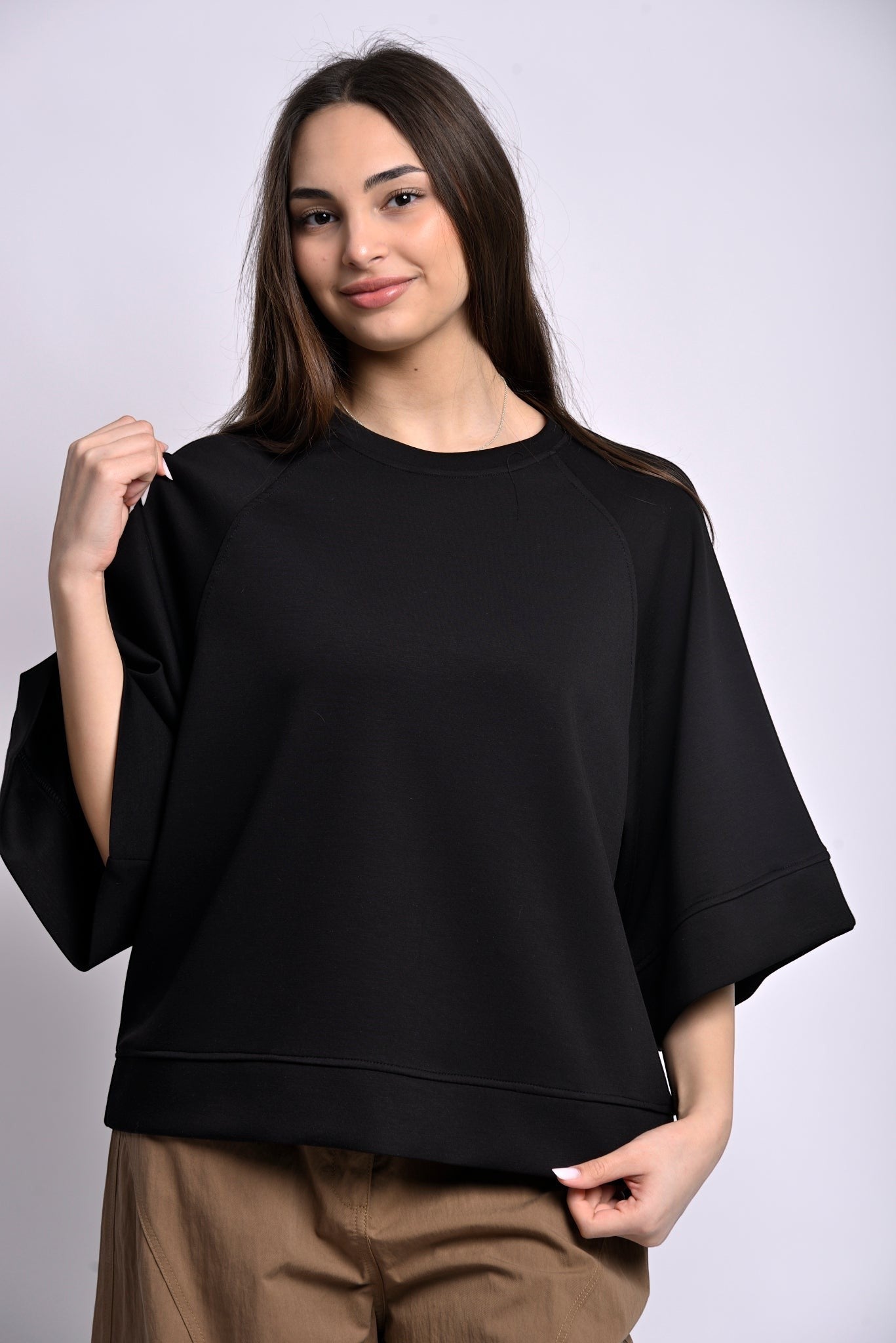 All Above Boutique black relaxed fit three-quarter sleeve top made of polyester, viscose, and elastane blend.