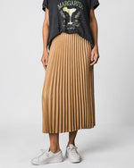 All Above Boutique camel pleated midi skirt with elastic waist, paired with a graphic tee and sneakers.
