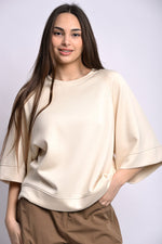 All Above Boutique cream relaxed fit three-quarter sleeve top made of polyester, viscose, and elastane blend.