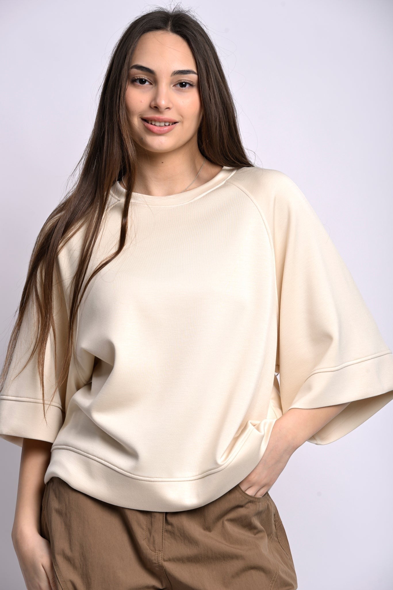 All Above Boutique cream relaxed fit three-quarter sleeve top made of polyester, viscose, and elastane blend.