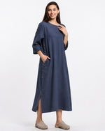 All Above Boutique navy blue Tencel midi dress with side buttons, pockets, and 3/4 sleeves.