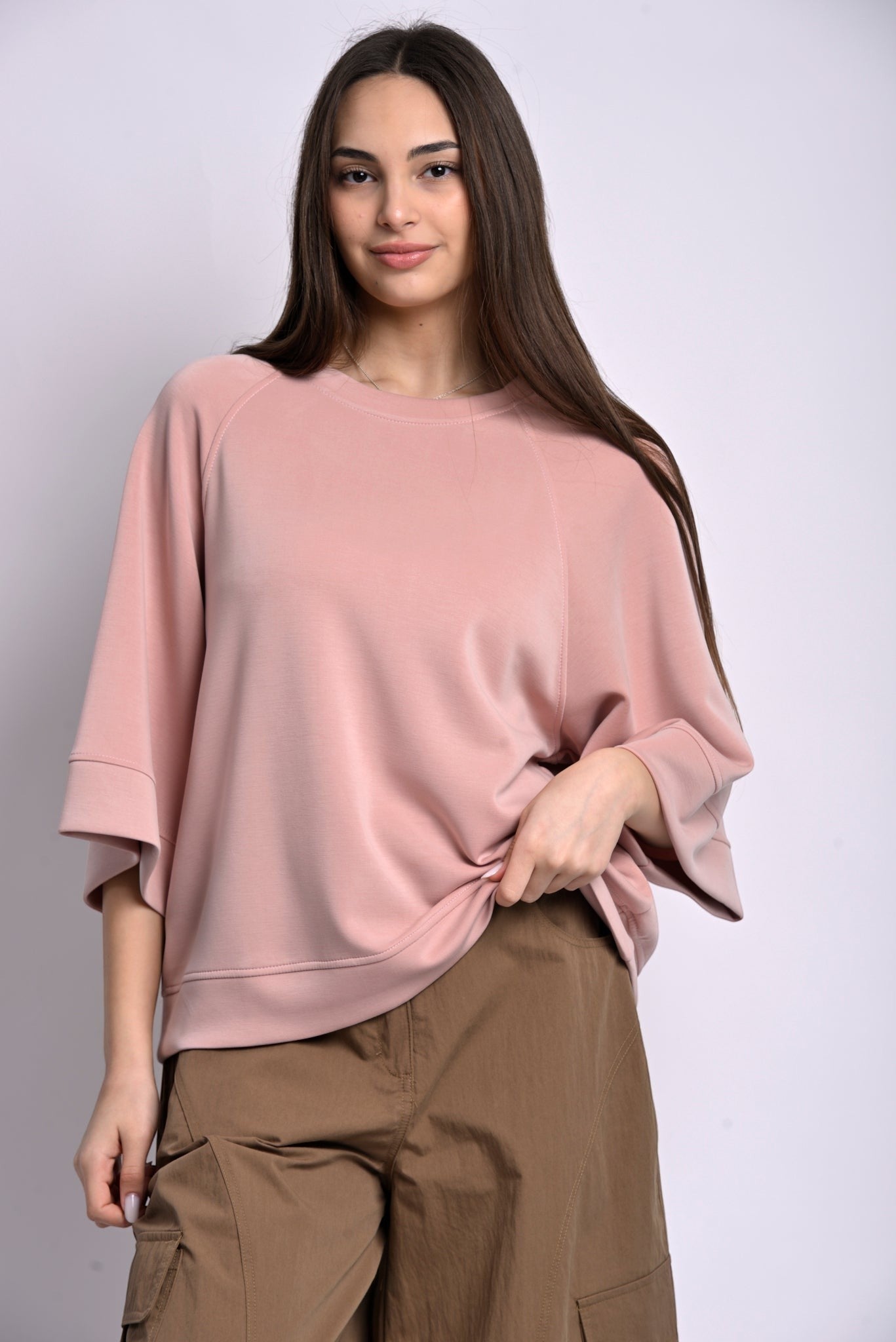All Above Boutique pale pink relaxed fit sweatshirt with three-quarter sleeves and dropped shoulders, made from a soft polyester blend.