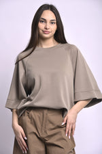 All Above Boutique taupe relaxed fit three-quarter sleeve top made of polyester, viscose, and elastane blend.