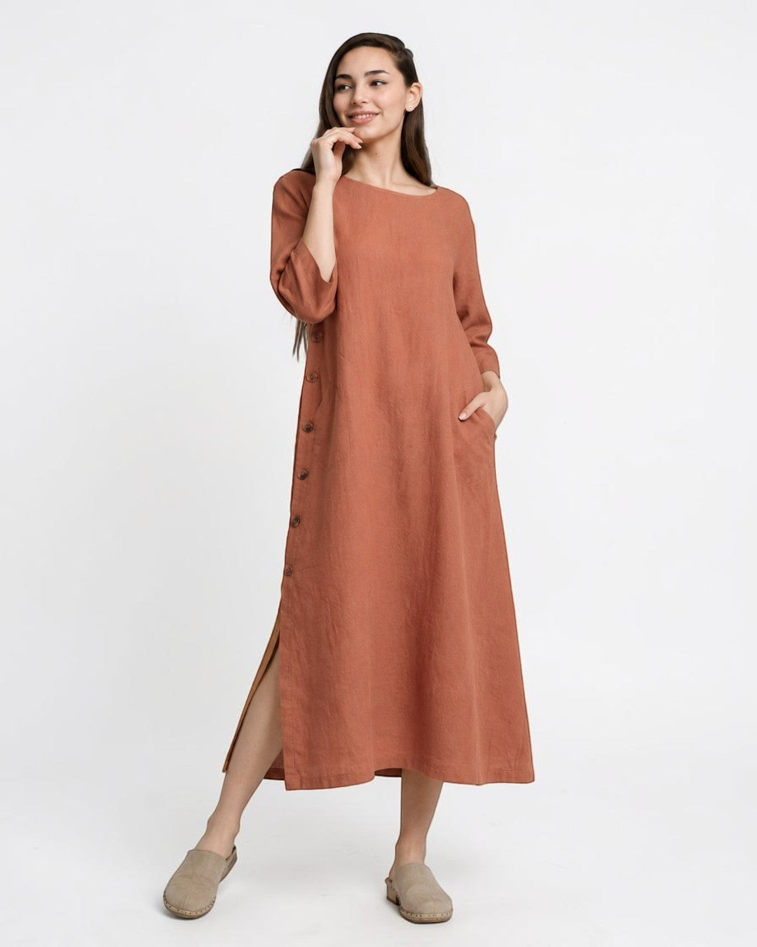 All Above Boutique terracotta Tencel midi dress with side buttons, slits, and pockets. Loose fit, 3/4 sleeves.