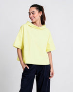All Above Boutique light yellow 100% cotton relaxed fit short sleeve top with boat neck