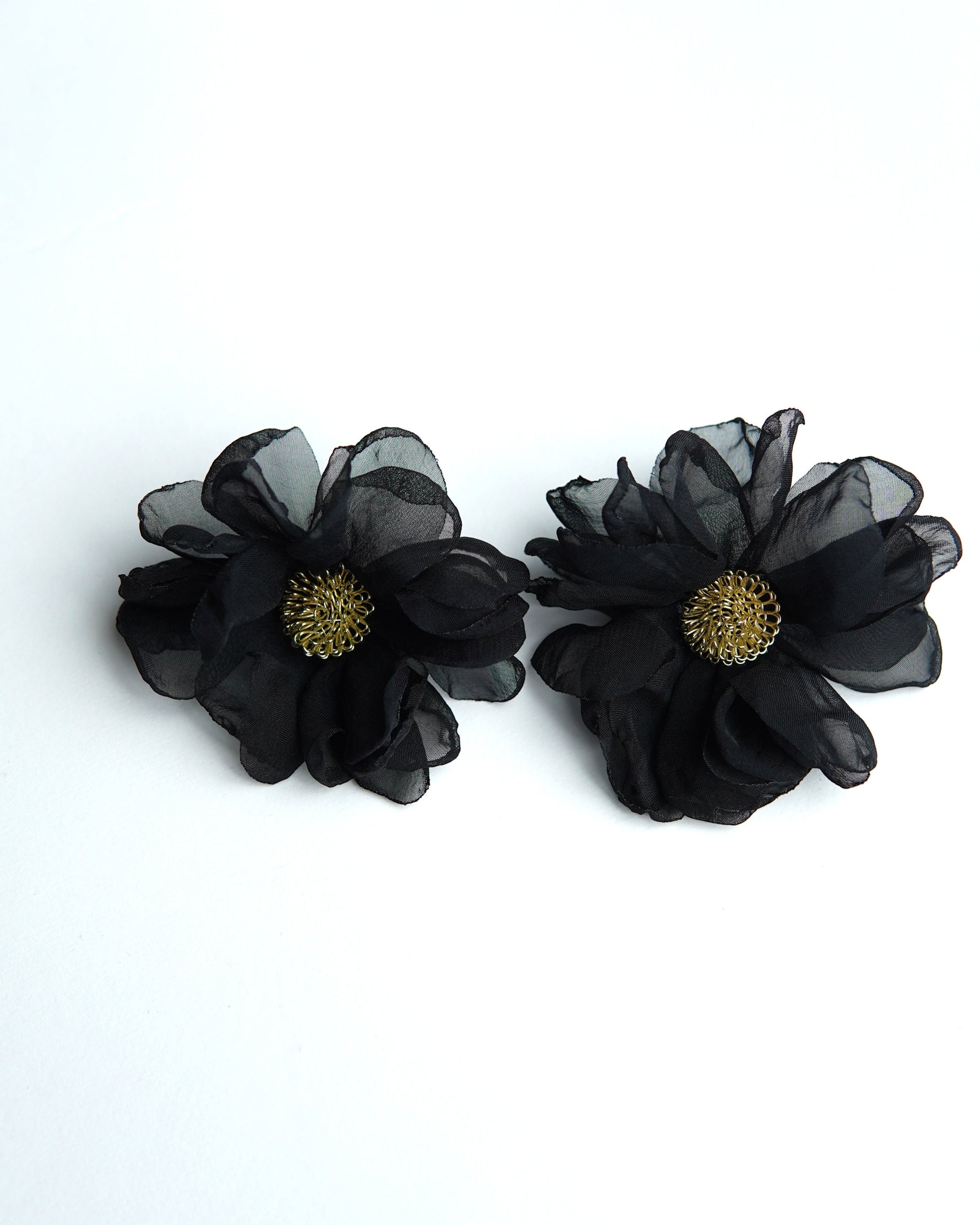 All Above Boutique black fabric flower earrings with gold center detail, delicate and romantic design.