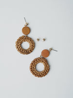 All Above Boutique boho style braided wood hoop earrings with wooden disc accent. Natural texture, statement earrings.