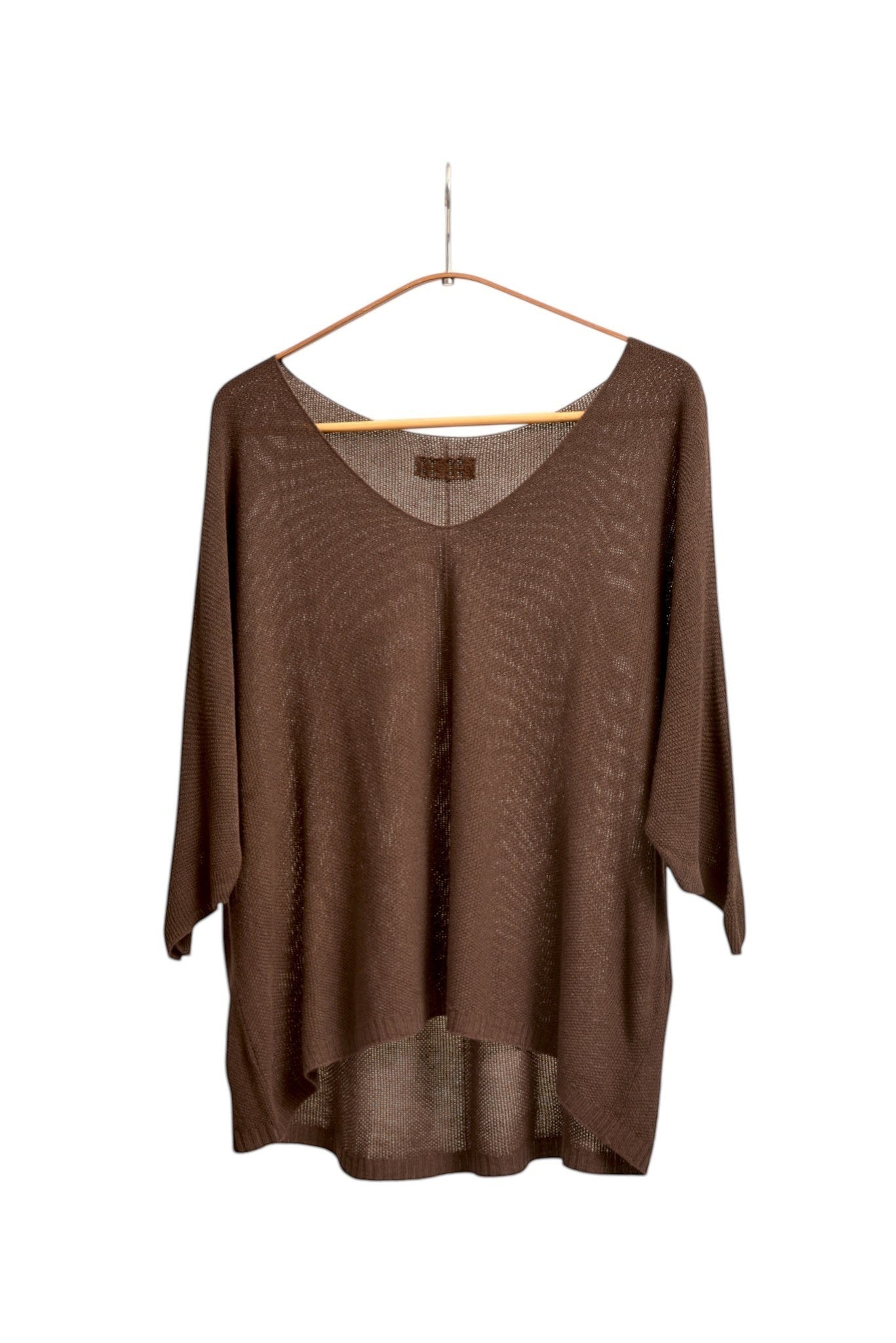 All Above Boutique brown V-neck relaxed fit knit sweater with dropped shoulders and a textured bob de orez weave.