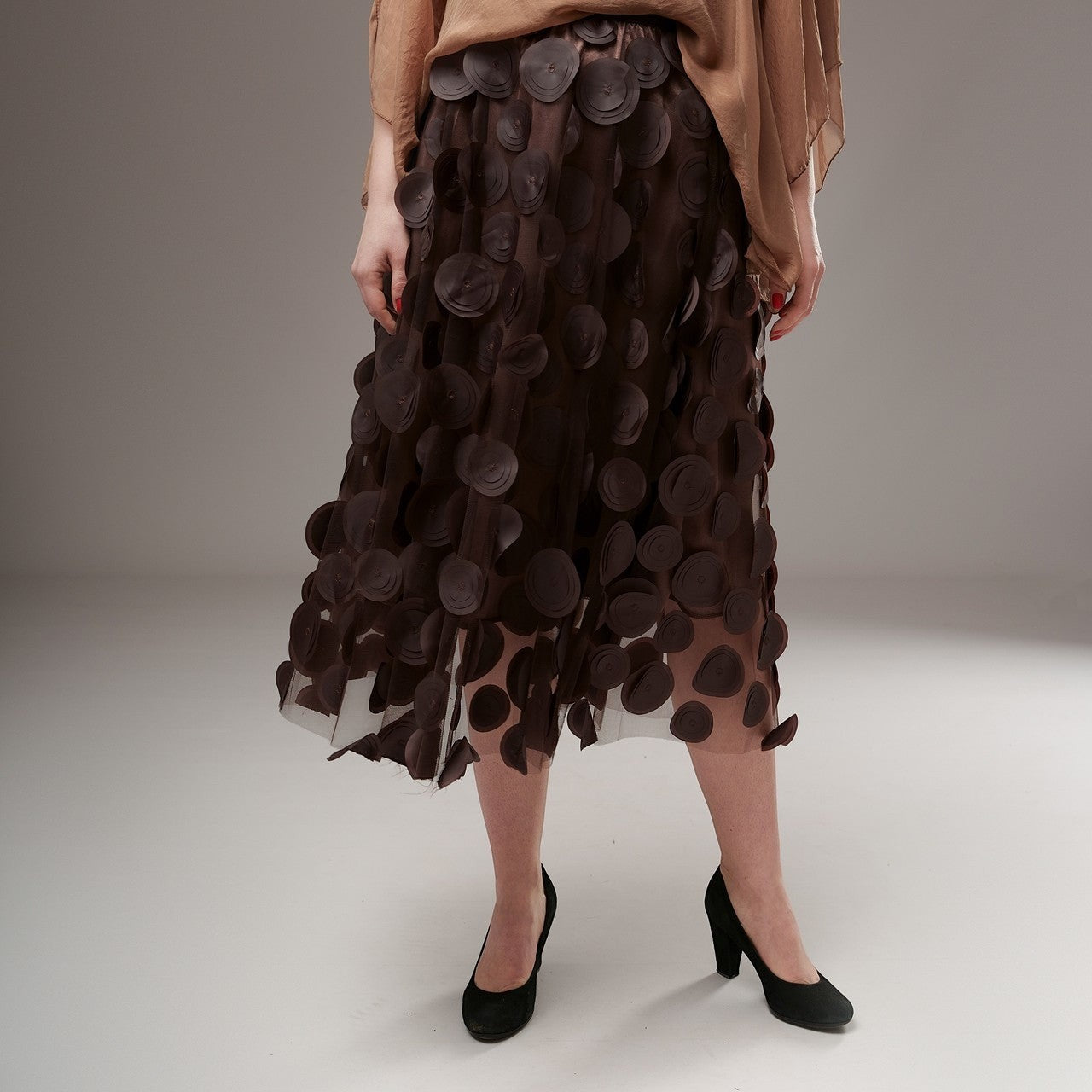 All Above Boutique brown midi tulle skirt with applied petal details and elastic waist. Elegant and romantic design.