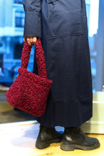All Above Boutique burgundy teddy fabric handbag with double handles and magnetic snap closure. Modern chic style.