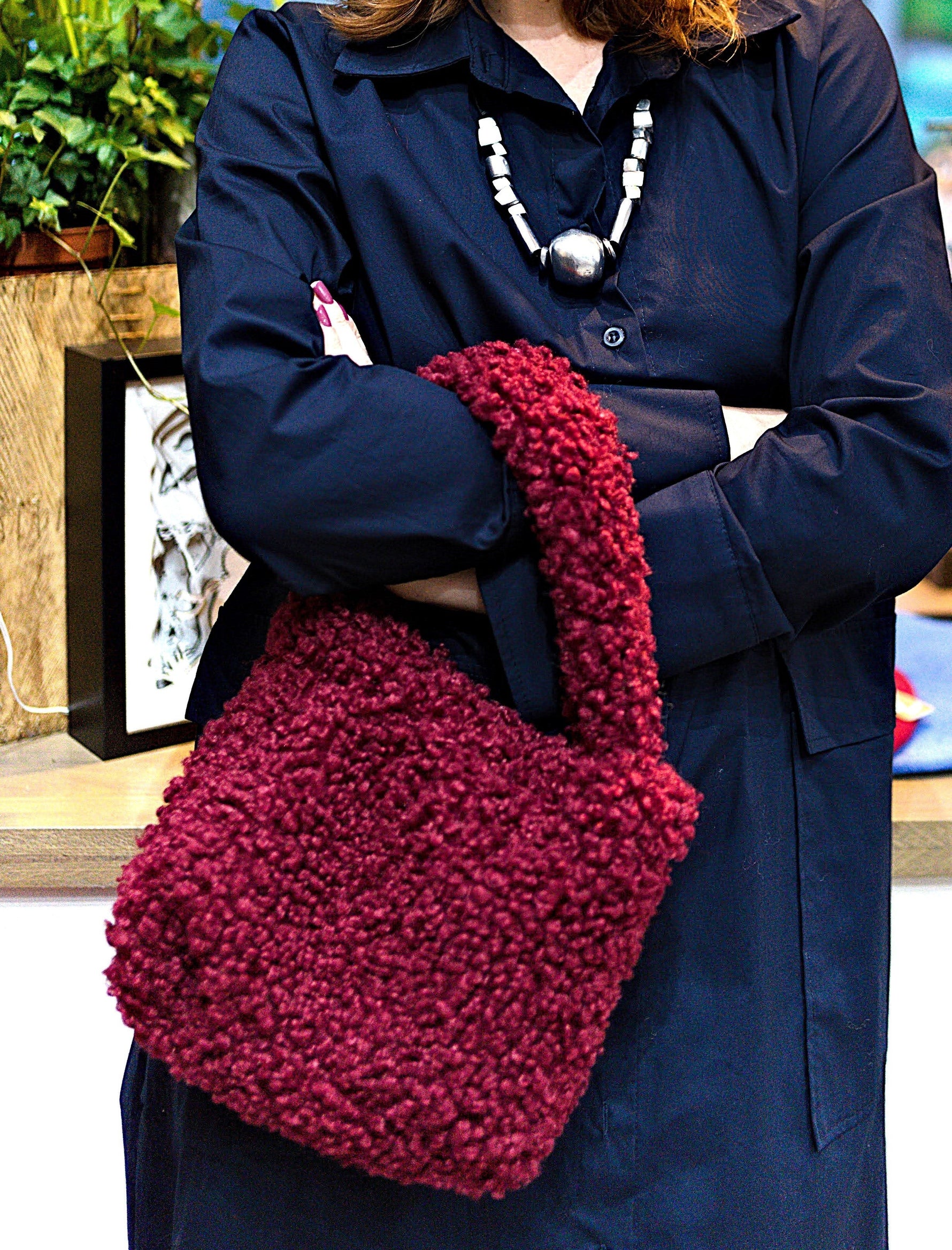 All Above Boutique burgundy teddy fabric tote bag with double handles and magnetic snap closure.