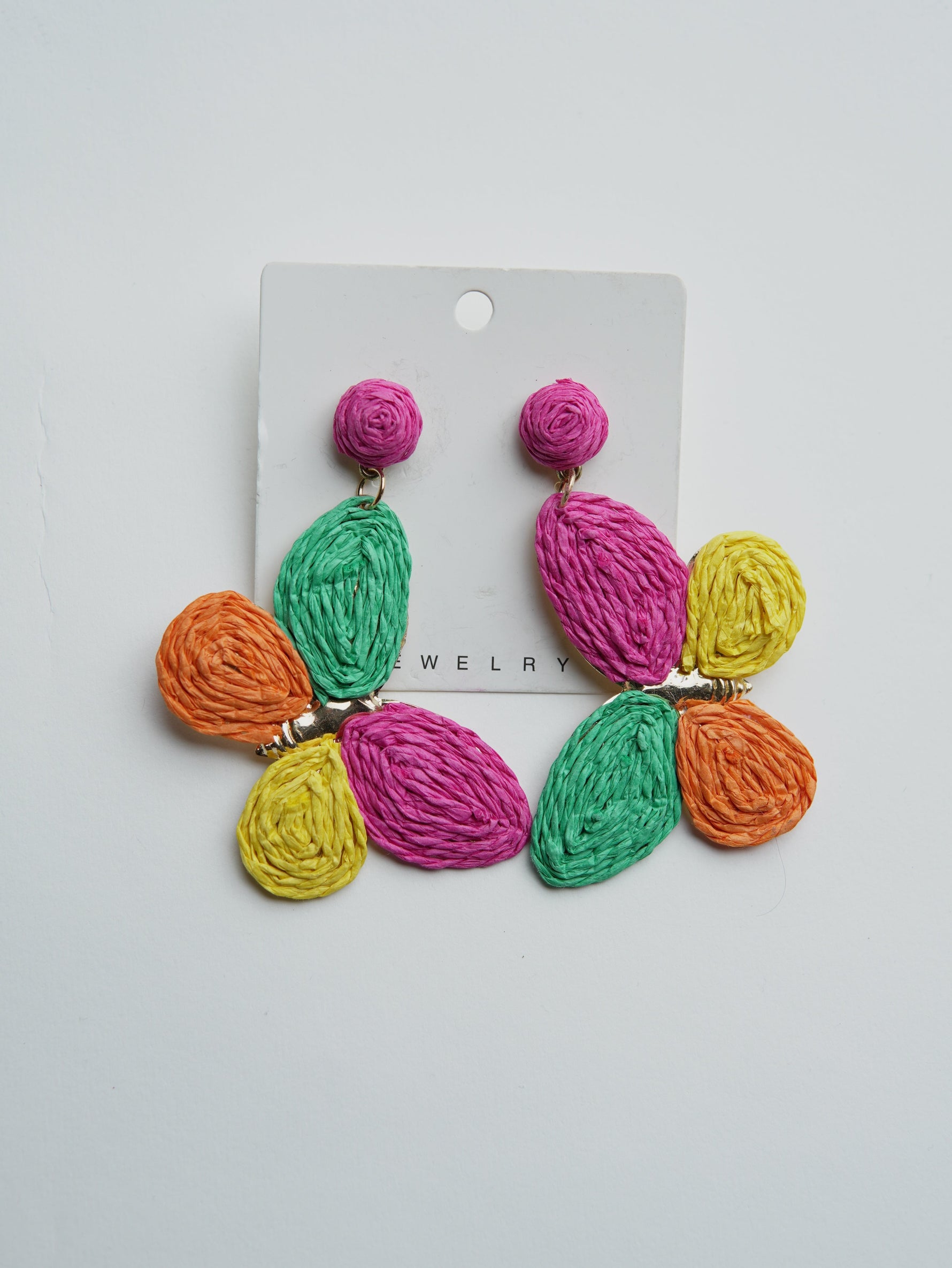 All Above Boutique statement boho butterfly earrings made of colorful raffia with gold-tone findings.