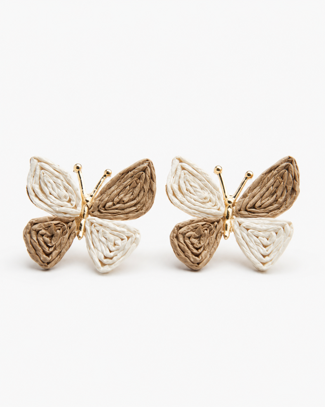 All Above Boutique butterfly earrings made of woven straw in beige and white, perfect for a boho summer look.