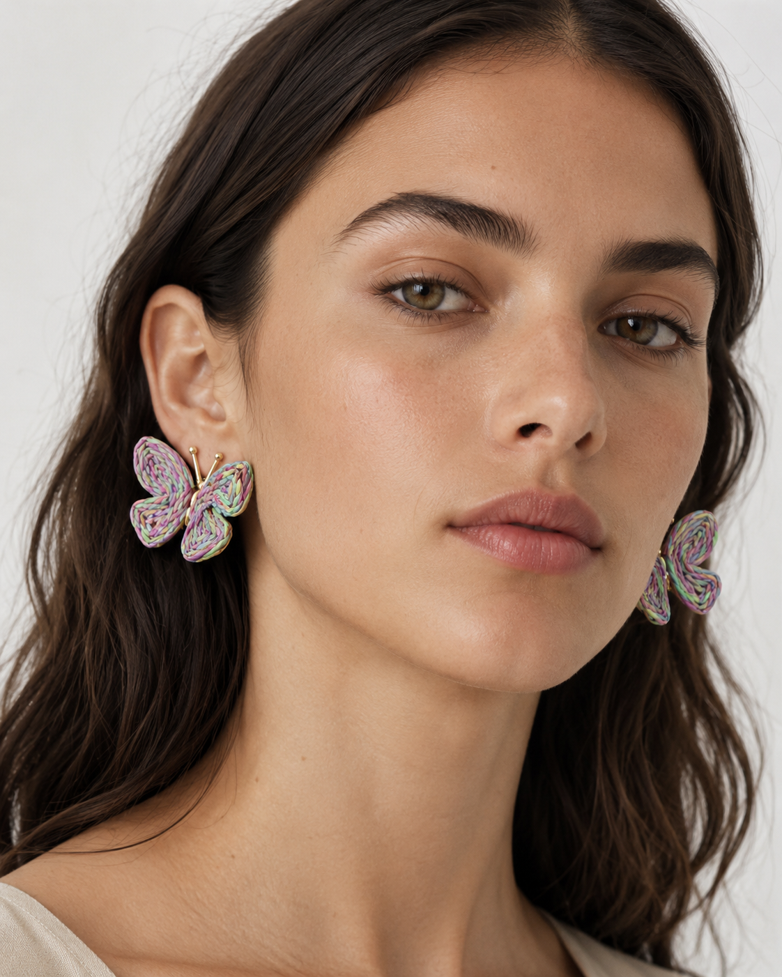 All Above Boutique pastel rainbow woven straw butterfly earrings with gold posts. Perfect for summer or boho style.