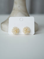 All Above Boutique delicate gold wire earrings with clear crystal flower design. Elegant and versatile.