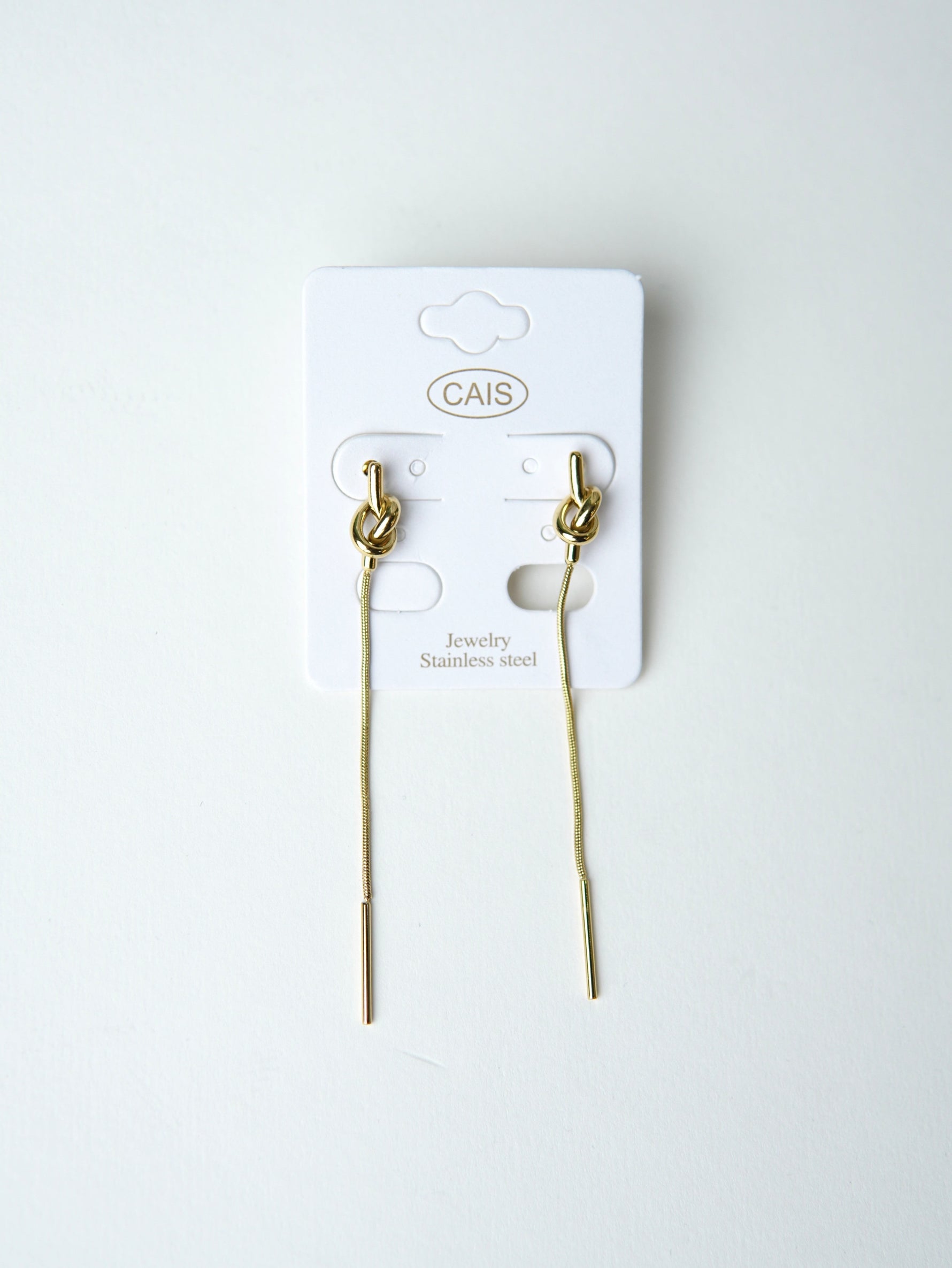 All Above Boutique gold knot drop earrings with long chain and bar end, minimalist stainless steel jewelry.