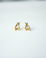 All Above Boutique gold organic asymmetrical hoop earrings with a polished finish.