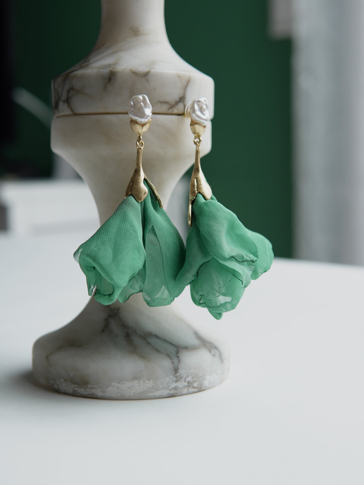 All Above Boutique green satin flower and pearl drop earrings. Gold-tone stainless steel.