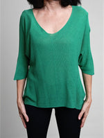 All Above Boutique green V-neck relaxed fit knit sweater with dropped shoulders and 3/4 sleeves.