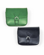 All Above Boutique green and black leather crossbody satchel with buckle closure and adjustable strap.