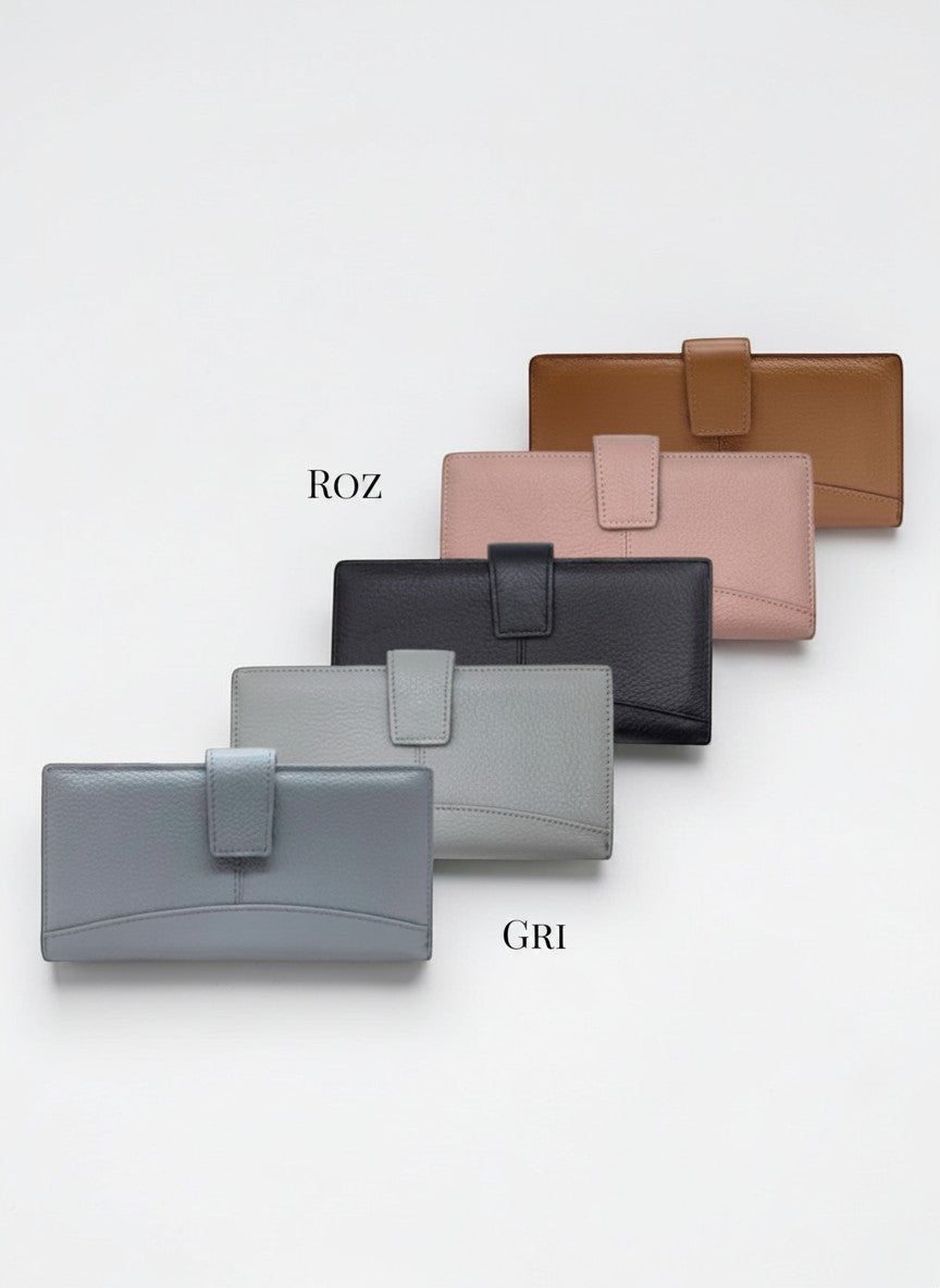 All Above Boutique collection of leather wallets in camel, pink, black, grey, and blue, featuring multiple card slots and a secure clasp closure.